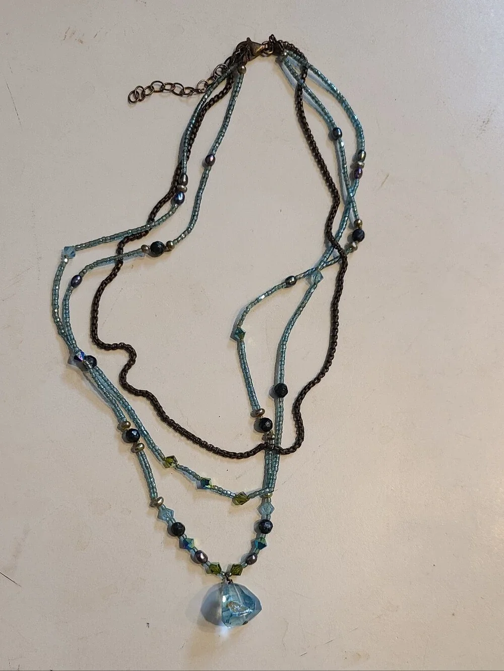 Beaded Multi-Strand Blue And Turquoise Pendant Necklace